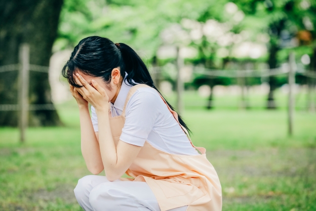 病んだ様子の看護師